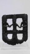 A Benin bronze Oba Ohen plaque with three figures (Oba and two attendants) holding hands. Mounted on