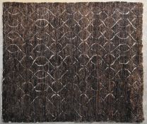 A contemporary carpet with allover scrolling interlocking pattern on a deep bronze field. L.
