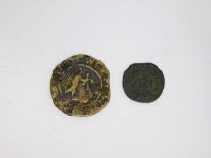 Two ancient coins. Including a yellow metal coin with a kneeling stag and lettering on the reverse