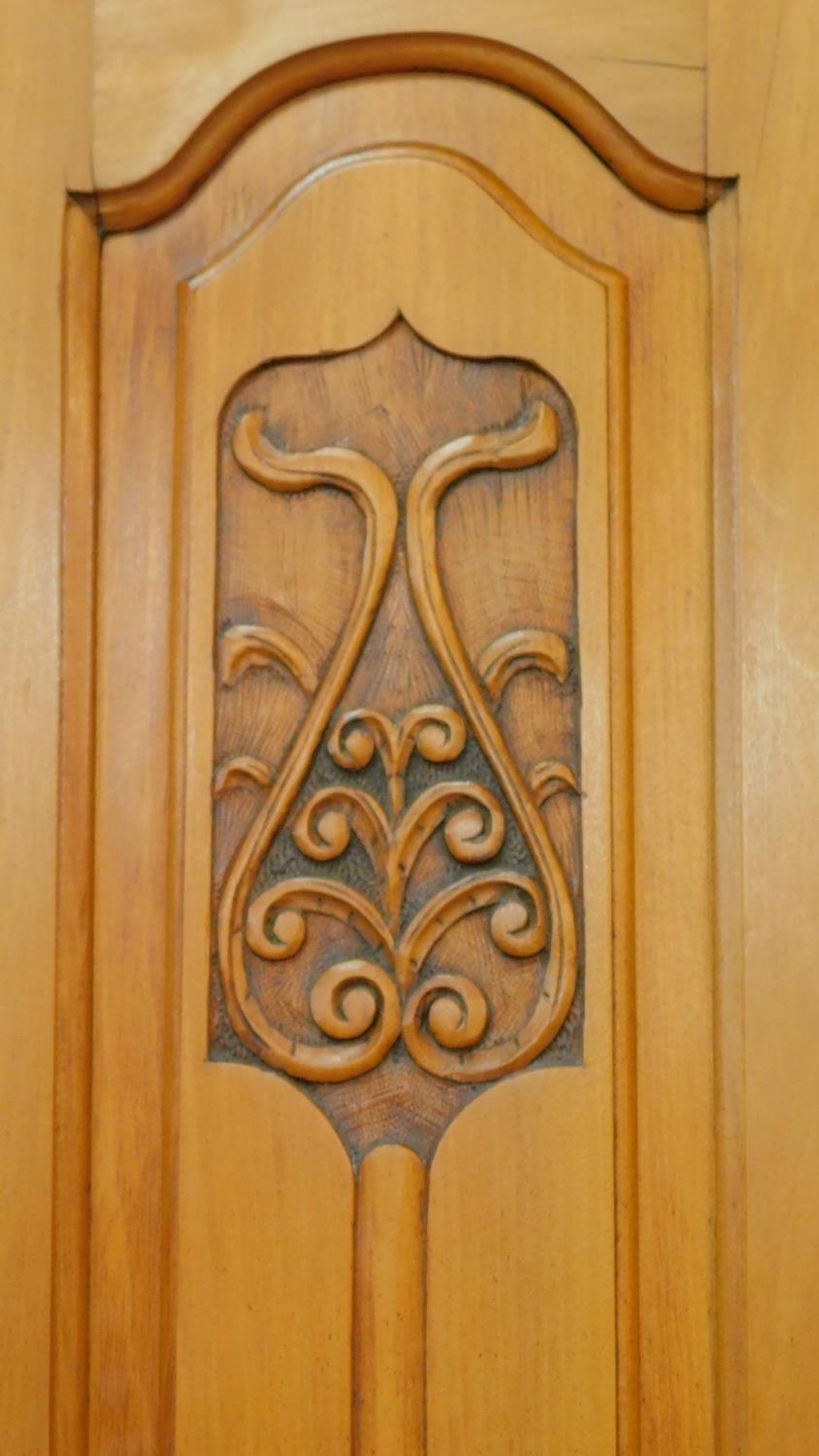 A late 19th century satin walnut wardrobe with central shaped bevelled mirror door flanked by Art - Image 5 of 9