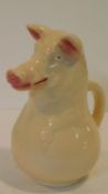 A Sarreguemines majolica ceramic jug in the form of a pig, impressed pat.no 3318 and makers mark.