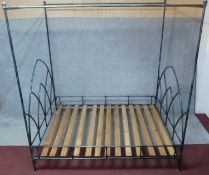 A iron framed tester bedstead with arched Gothic style head and foot. to take a 5 ft mattress.