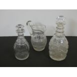 Two antique cut crystal decanters and a crystal cross hatched design jug. H.28cm