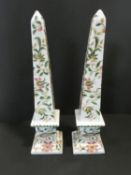 A pair of Chinese ceramic obelisks with all over bird and flower decoration and Chinese character