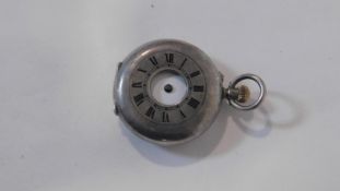 An antique small silver half hunter fob watch. Hallmarked with CN for Stauffer, Son & Co. White