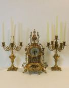 A contemporary 19th century French style clock garniture in ornate brass cast case fitted with