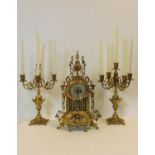 A contemporary 19th century French style clock garniture in ornate brass cast case fitted with