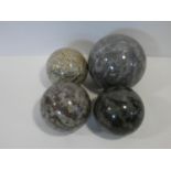 A miscellaneous collection of four various sized veined polished marble spheres. D.15cm (largest)