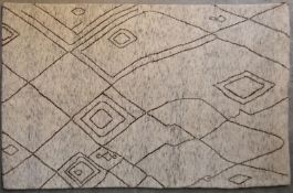 A Moroccan rug with abstract linear design on a pale flecked ivory ground. L.237x152cm