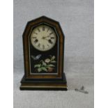 A late 19th century walnut cased mantel clock with enamel dial and Roman numerals and painted