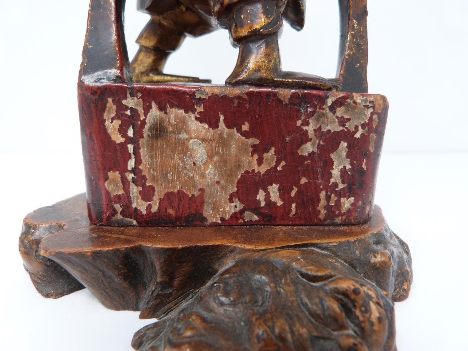 A Qing dynasty gilt red lacquer carved wooden guardian figure on square base. H22cm - Image 2 of 13
