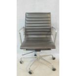 A vintage Charles and Ray Eames inspired Aluminium Group style office desk armchair in black