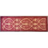 An Ottoman runner with allover scrolling vine decoration contained within a plain border. L.240x80cm