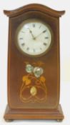 A late 19th century mahogany cased mantel clock with white enamel dial and Roman numerals and