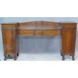 A Regency flame mahogany dwarf sideboard the sunken central section fitted with frieze drawer