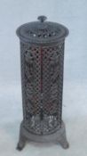 A 19th century style wrought iron greenhouse heater case with allover pierced scrolling