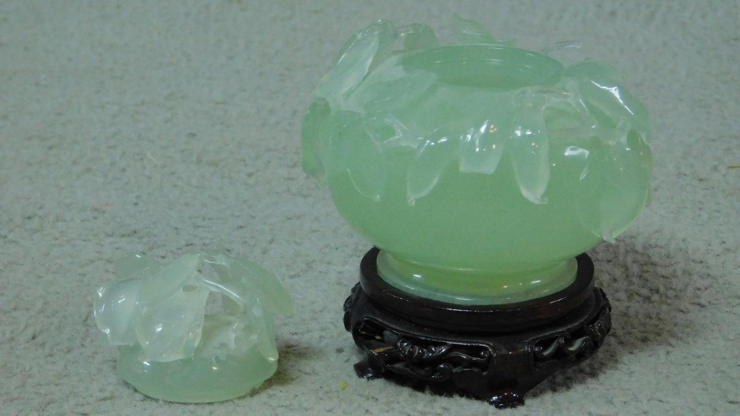 A 20th century serpentine jade lidded censer on a footed pierced carved hardwood base. The censer is - Image 2 of 8