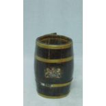 An antique brass banded and oak barrel shaped stick/umbrella stand with painted royal crest, with