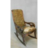 A Victorian mahogany framed rocking armchair in tapestry style upholstery. H.100 W.53 D.90cm