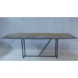 A contemporary metal topped industrial style coffee table on metal tubular base. H.59 W.170 D.60cm
