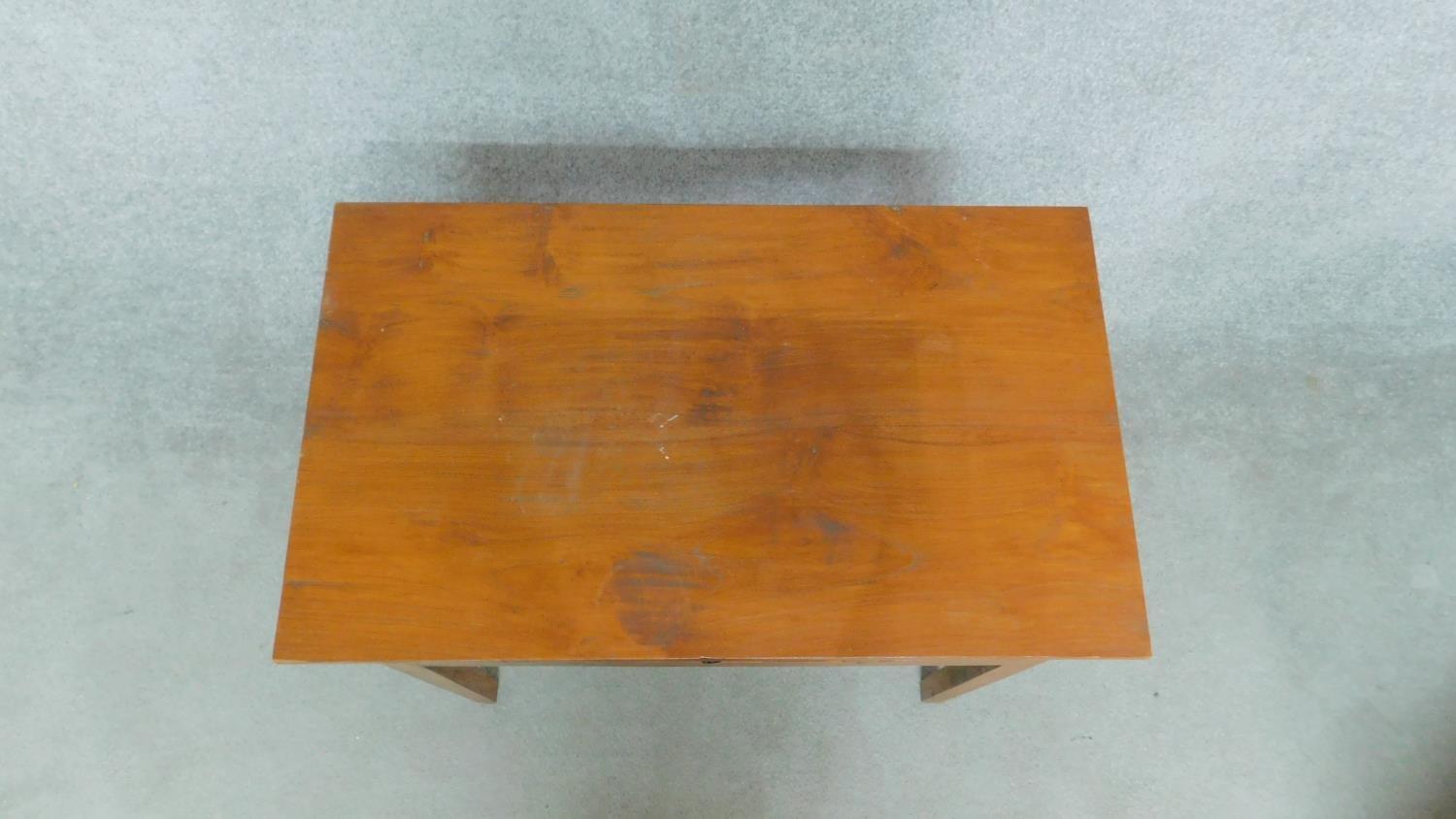 An Eastern teak side table fitted with frieze drawer flanked by floral carved panels on square - Image 2 of 4