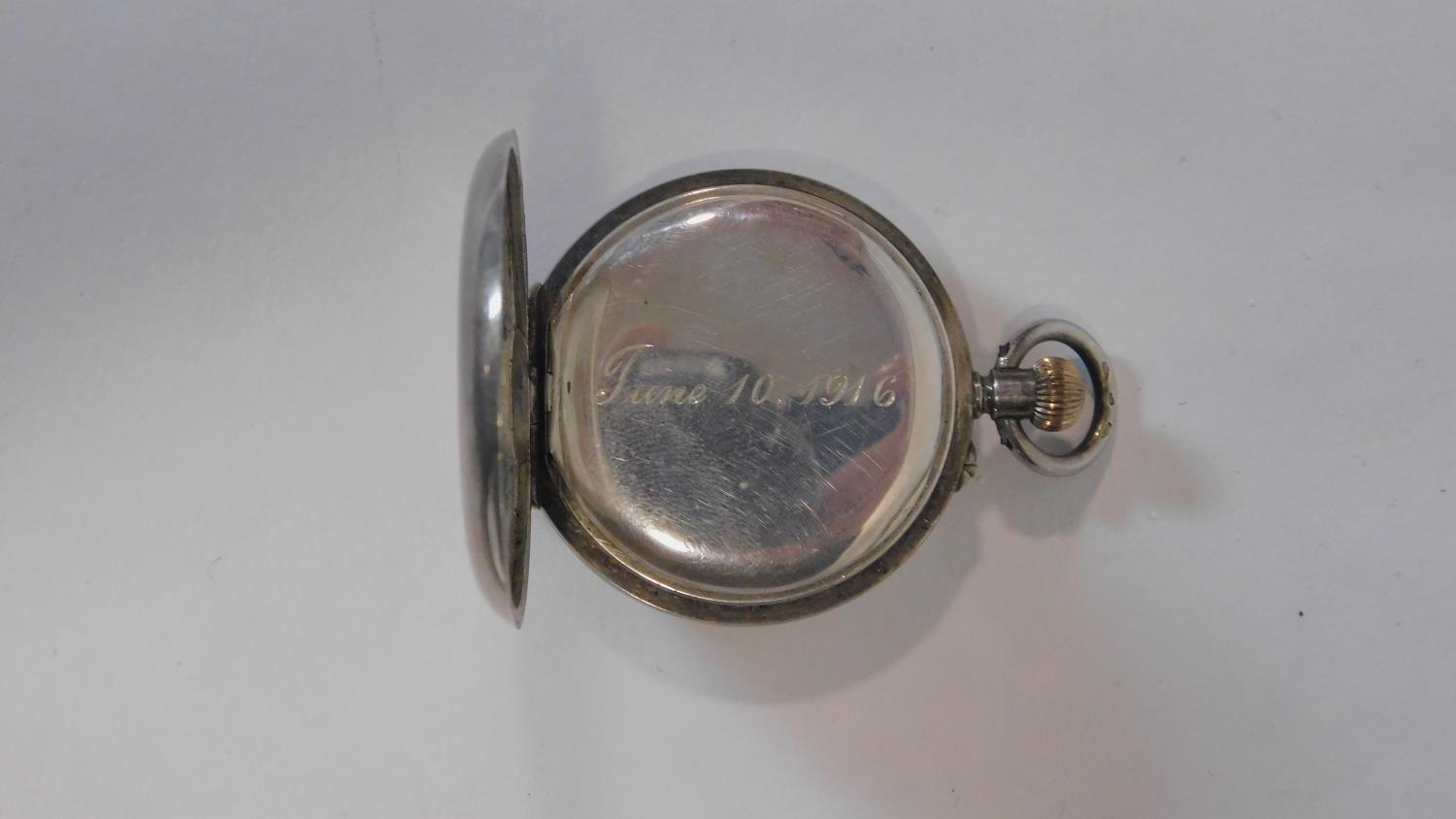 An antique small silver half hunter fob watch. Hallmarked with swiss hallmarks, 935. White enamel - Image 4 of 4