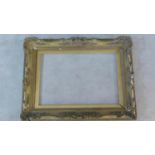 A 19th century gesso Rococo style picture frame. 93x123cm