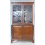 A 19th century mahogany and satinwood strung library bookcase with astragal glazed doors above