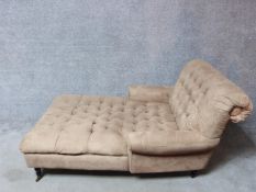 A Victorian style day bed with buttoned faux suede upholstery to the back and seat raised on