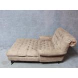 A Victorian style day bed with buttoned faux suede upholstery to the back and seat raised on