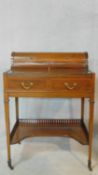 An Edwardian Sheraton style mahogany and satinwood inlaid bonheur du jour writing table with well