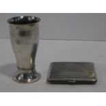 A silver plated shot glass with beaded detailng by Mortiz Hacker, stamped MH20, along with a white