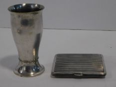 A silver plated shot glass with beaded detailng by Mortiz Hacker, stamped MH20, along with a white