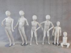 A miscellaneous collection of six children mannequins with swing arms. Three standing on bases. H.