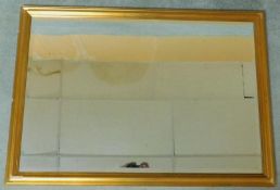A giltwood framed wall mirror with rectangular bevelled plate. 66x96cm