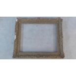 A gesso Rococo style picture frame. 103x125cm