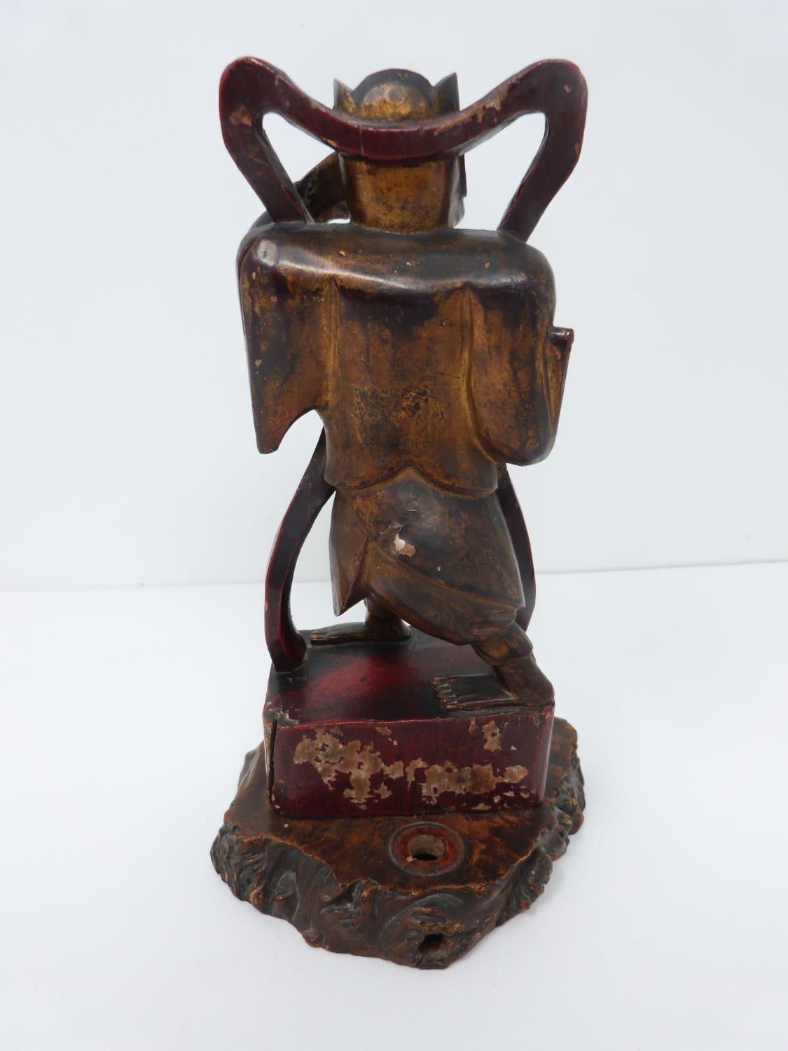 A Qing dynasty gilt red lacquer carved wooden guardian figure on square base. H22cm - Image 5 of 13