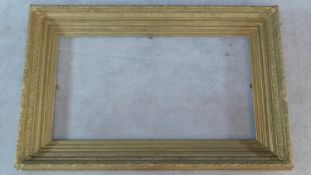 A 19th century giltwood and gesso picture frame. 93x144cm