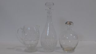A collection of crystal items. Inlcluding a cut crystal drop form crystal decanter with star cut