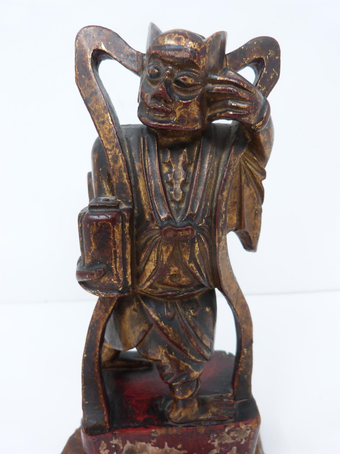 A Qing dynasty gilt red lacquer carved wooden guardian figure on square base. H22cm - Image 3 of 13