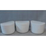 A set of three low stools in calico upholstery. H.40 W.58 D.45cm