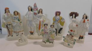 A collection of seven antique hand painted Staffordshire pottery figures, including a