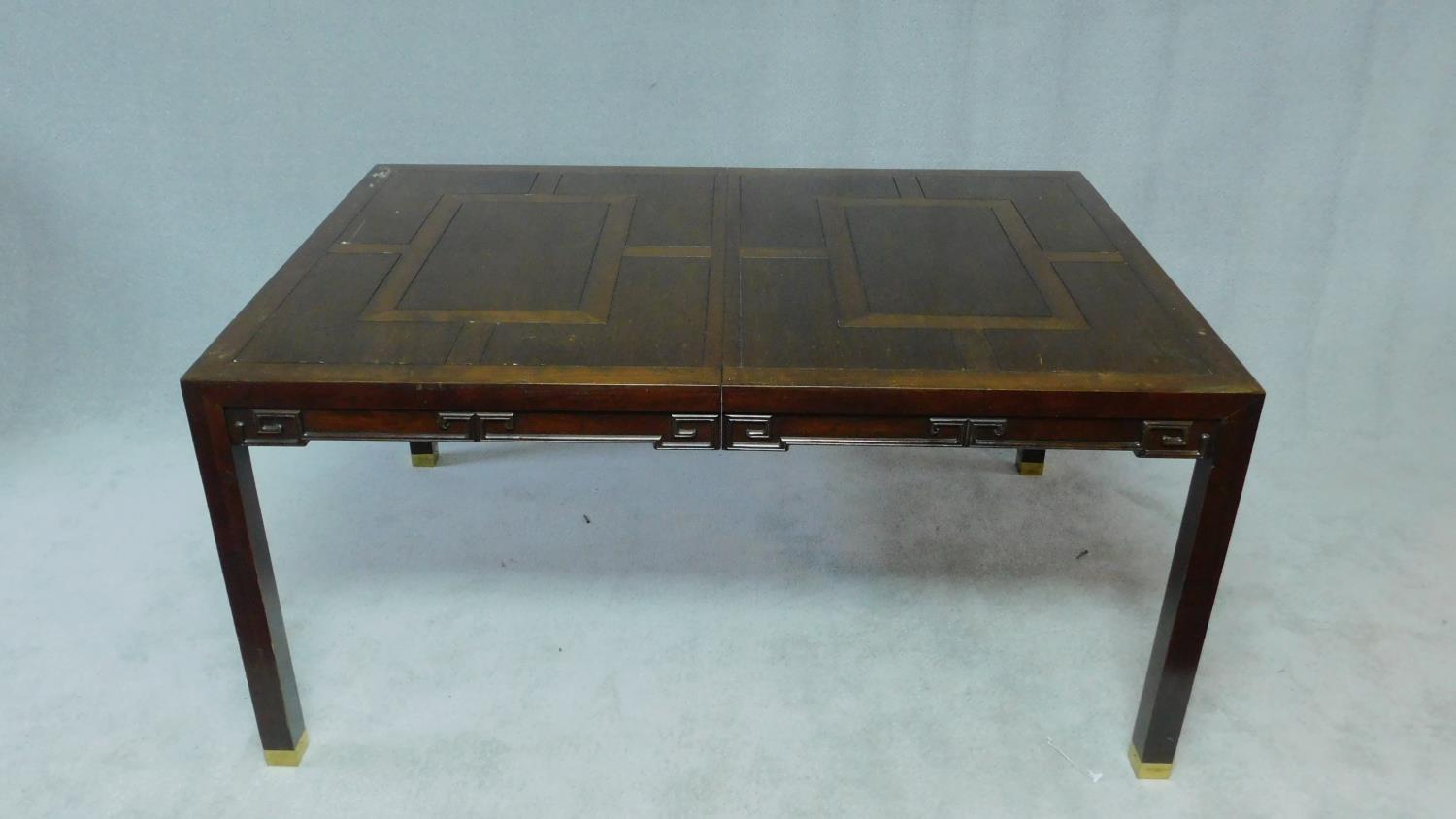 A Chinese hardwood extending dining table with parquetry top above carved frieze on square - Image 2 of 6