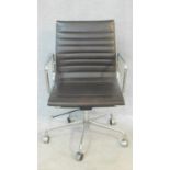 A vintage Charles and Ray Eames inspired Aluminium Group style office desk armchair in black