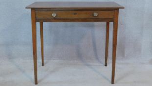 A Georgian mahogany side table fitted with frieze drawer raised on square tapering supports. H.75