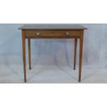 A Georgian mahogany side table fitted with frieze drawer raised on square tapering supports. H.75