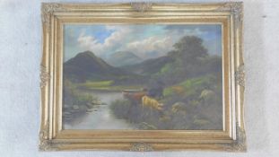 A 19th century gilt framed oil on canvas, Highland cattle in a lakescape, signed H Chester. 70x96cm