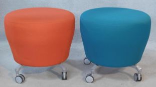 A pair of vintage Orangebox stools in apricot and azure upholstery on metal supports. H.50cm