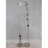 A pair of floor standing adjustable angle poise style lamps. H.157cm