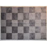 A contemporary rug with grey chequerboard pattern. L.144x94cm